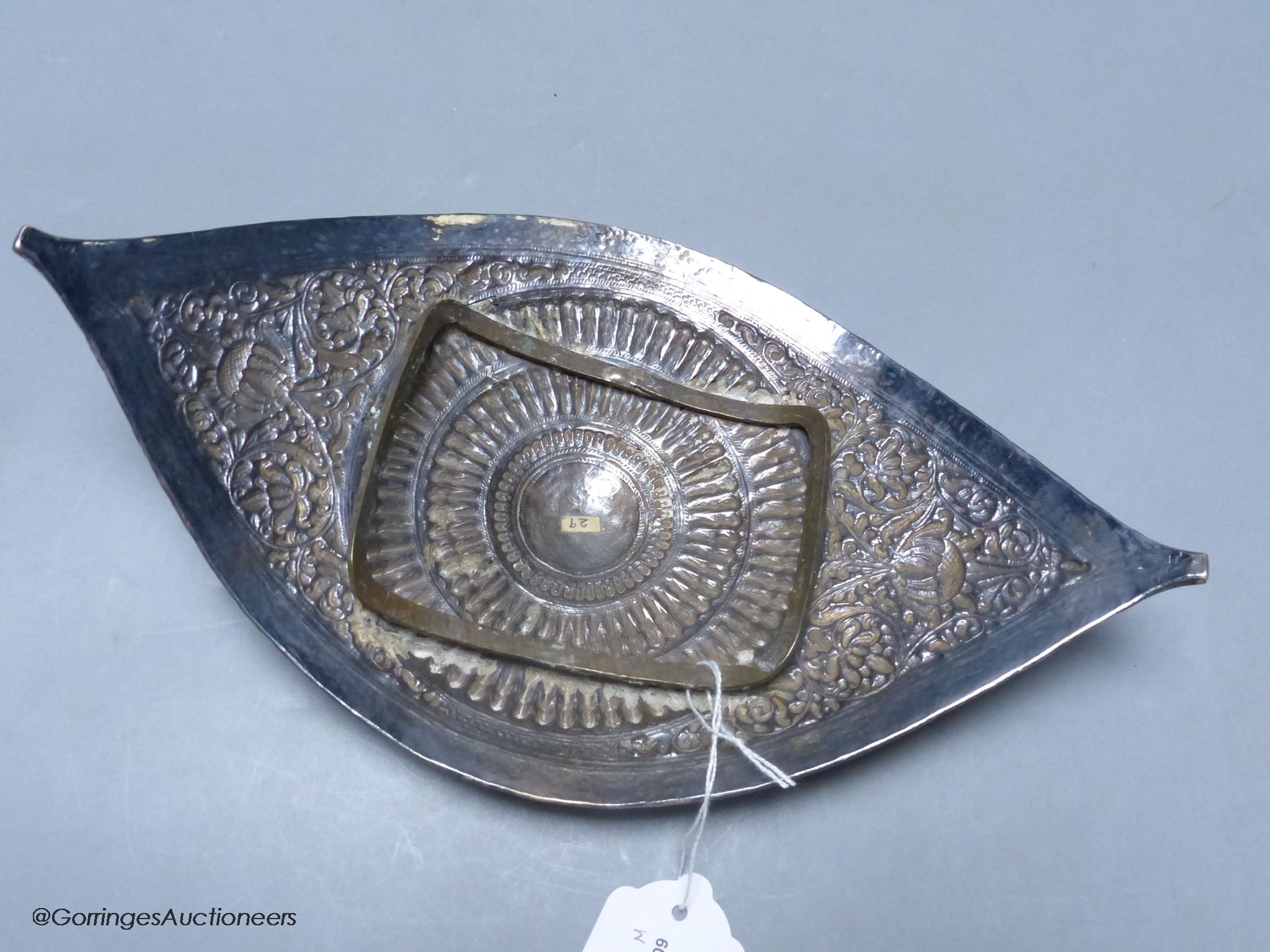 A Chinese Straits large white metal belt buckle, of curved navette form, L 28cm